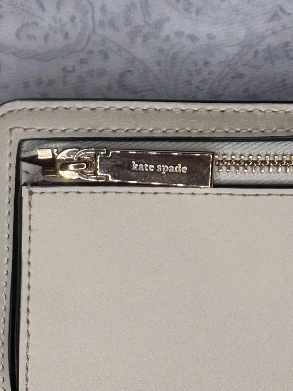 kate spade cream zip